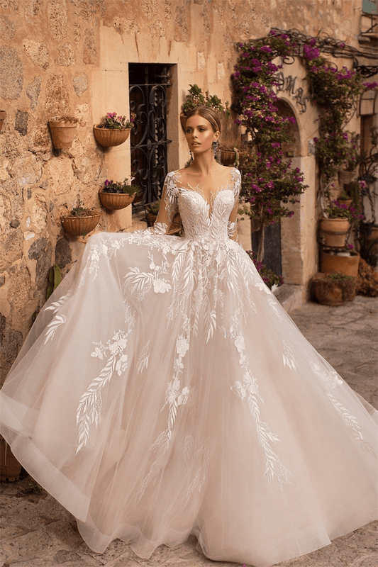 Long sleeve lace wedding dress with train